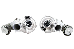 Two turbochargers on a whitebackground