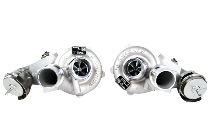 Two turbochargers on a whitebackground