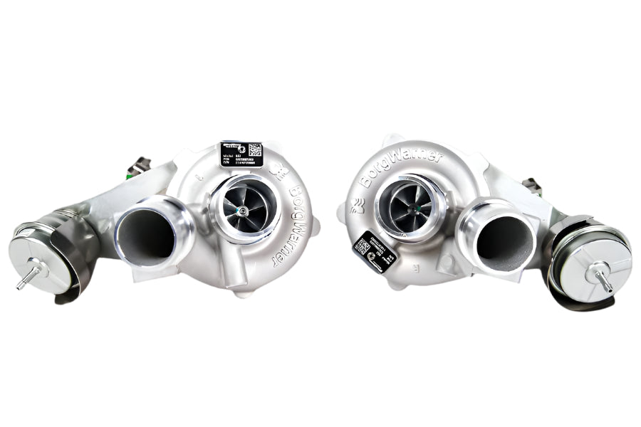 Two turbochargers on a whitebackground