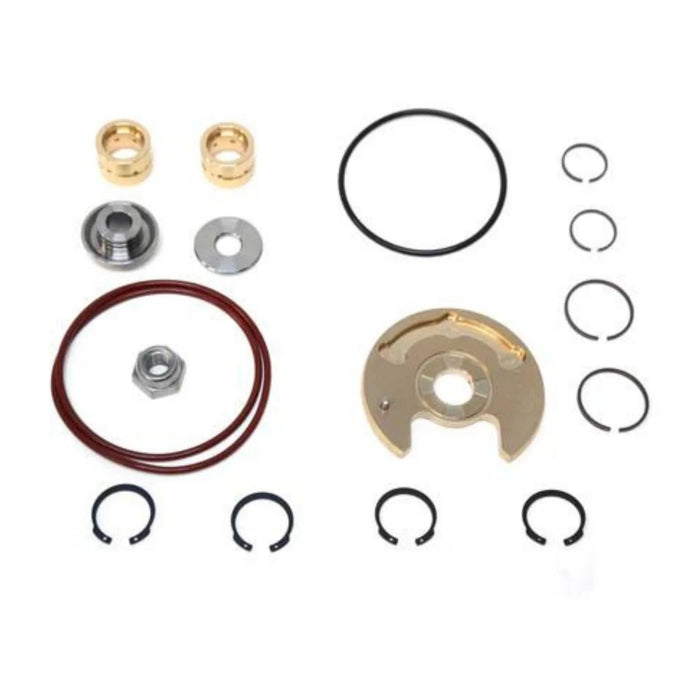 Set of mechanical parts including washers, rings, and bearings on a white background